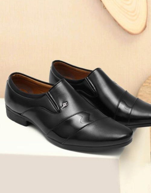 Solid black slip on shoes